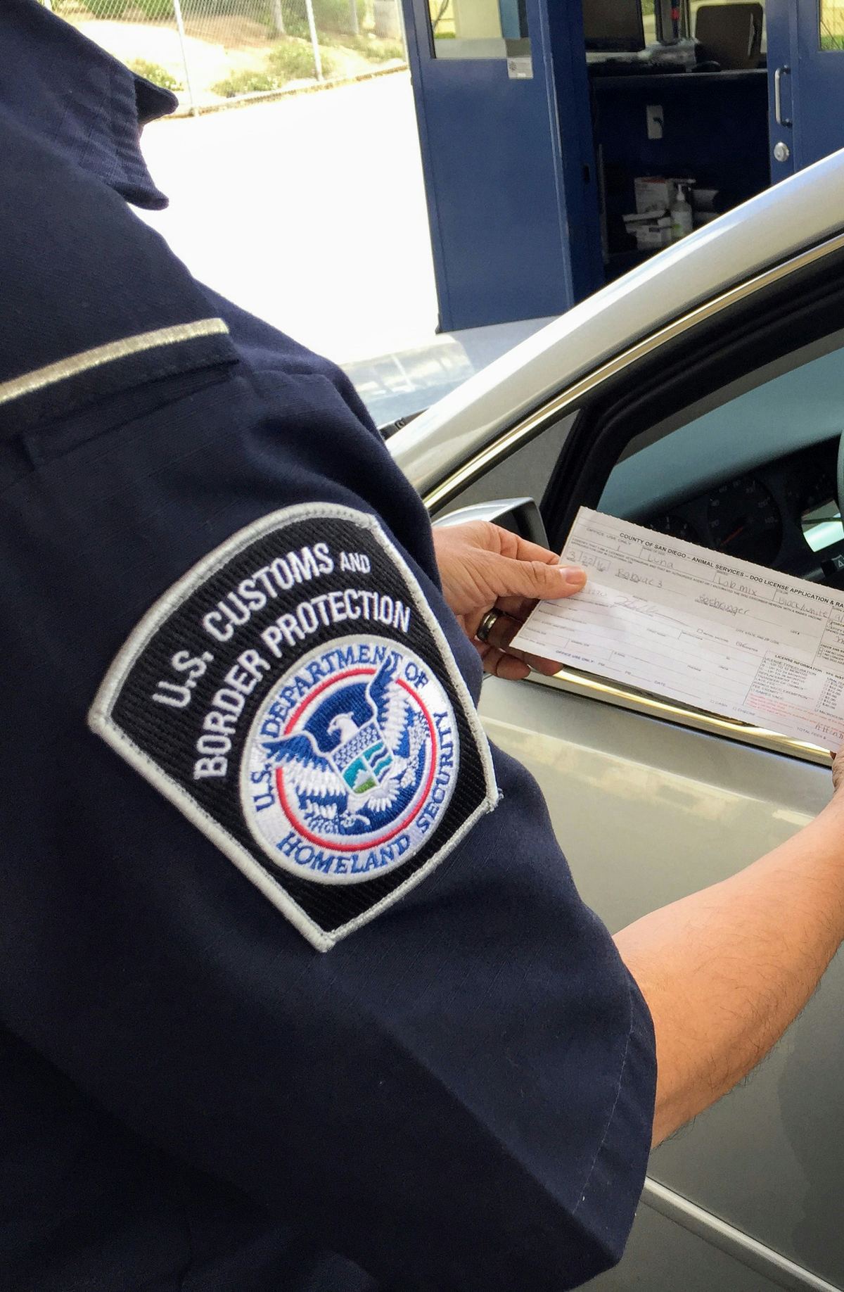U.S. Customs and Border Protection officer checking paperwork